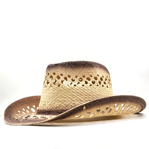 Detail of hand-woven straw cowboy hat with hollow diamond pattern and brown gradient finish