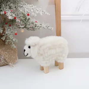 Handcrafted white wool felt sheep ornament with wooden legs for Christmas home decor