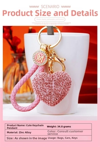 Pink rhinestone heart keychain with leather strap and gold charm detail for bags