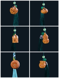 Detail of carved green sandalwood pendants with tassels in lotus and gourd shapes