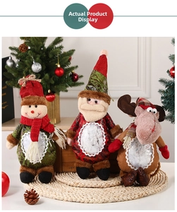 Three plush Christmas candy jars featuring Santa, snowman and reindeer on a cozy backdrop