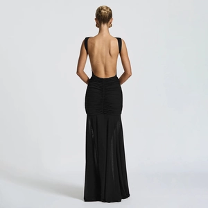 Macro view of sexy black backless long dress featuring pleated detail and side slit design