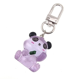 Close-up of translucent purple and black jelly panda keychain with metallic ring