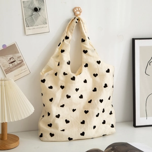 Textured cream canvas tote bag with black heart pattern large capacity shoulder bag