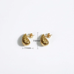 Detailed view of golden teardrop earrings with quilted texture and 19mm height