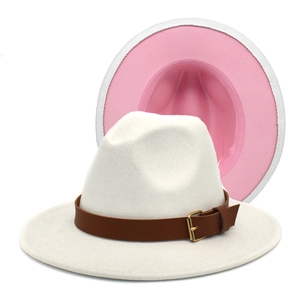 Detail of two-tone fedora hat showing cream exterior and bright pink interior lining