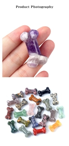 Macro shot of hand-held bone-shaped carved natural crystals and variety of gemstones