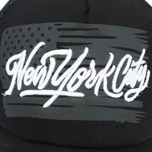 Black trucker hat with distressed US flag print and white New York City embroidery