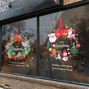 Christmas window decals featuring snowman reindeer wreaths and festive Merry Christmas text