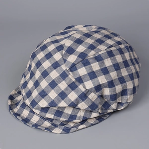 Detail of blue and white checkered cotton linen texture on a retro flat cap