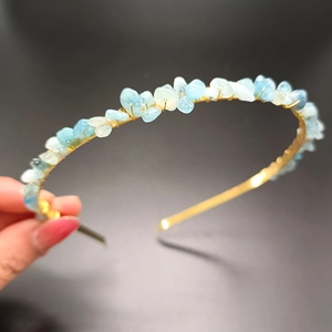 Detail of handmade crown headband featuring raw light blue aquamarine crystal stones