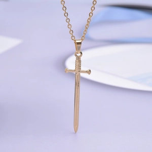 Detailed view of a gold-plated stainless steel fencing sword pendant on a fine O-chain