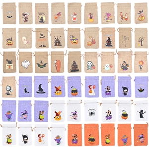 Detail view of multicolored Halloween burlap drawstring bags with various festive prints
