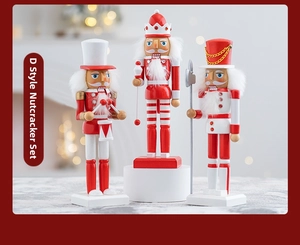Three-piece wooden Nutcracker soldier set with drum and scepter in festive red and gold