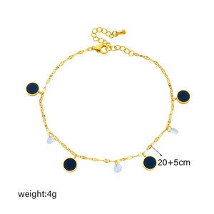 Golden chain anklet with dark blue enamel charm and light blue droplet crystal charm