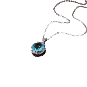 Elegant silver necklace with blue zircon rose pendant and sparkling crystal halo