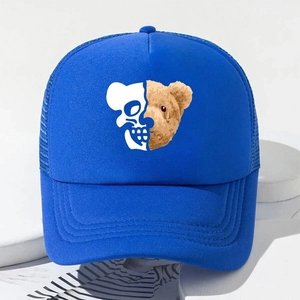 Detail of royal blue trucker hat showing front cotton panel and mesh back with bear print