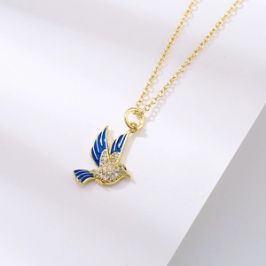 Gold-plated love bird pendant necklace with micro-p鑲 zircorn stones on white surface