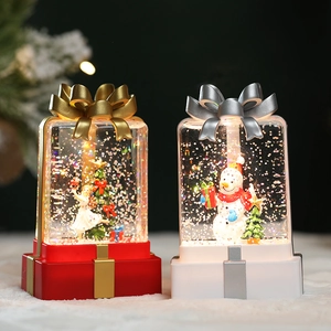 Christmas LED light-up gift box lanterns with Santa and Angel figurines in warm light