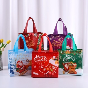 Set of five colorful non-woven Christmas gift bags with festive holiday patterns