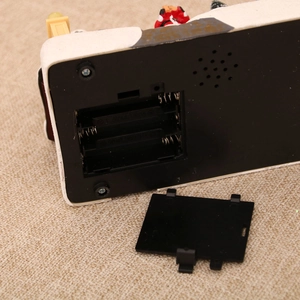 Detail view of the battery compartment and 1.5V AA specifications for the Christmas ornament