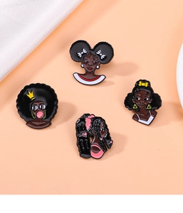 Detailed view of four assorted black girl cartoon pins in drip oil alloy for hip hop style