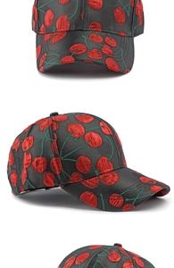Detailed views of cherry jacquard embroidery on black fashion baseball cap fabric