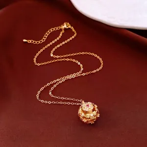 Vintage gold sphere floral pendant necklace with red gemstone and white zircon accents