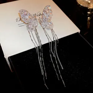 Sparkling zircon butterfly tassel earrings with silver chains on white display box