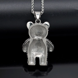 Hip hop titanium steel necklace featuring a crystal bear pendant on a black background