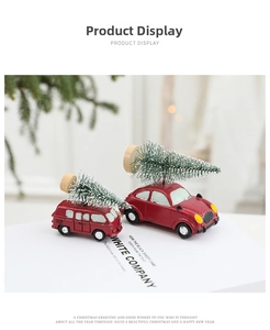Macro view of two vintage red resin cars with mini snowy Christmas trees on top