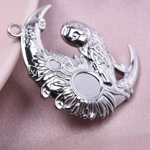 Macro shot of 304 stainless steel crescent moon pendant with sunflower relief detail
