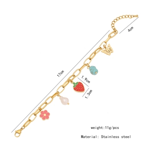 Macro detail of stainless steel charm bracelet showing 21cm length and various pendants