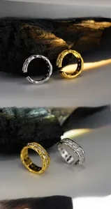 Macro detail of gold and silver textured ear cuffs with sparkling cubic zirconia stones
