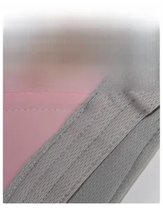 Detail of pink visor featuring a wide moisture-wicking sweatband and grey sweat-guide texture