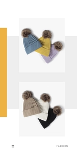 Detail showing various colors of thick knit hats with fluffy pom-poms for winter style