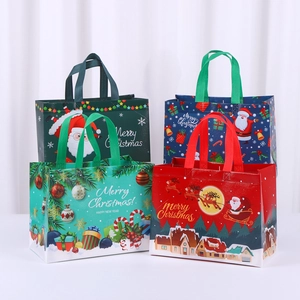Set of four colorful non-woven Christmas gift bags featuring festive holiday prints
