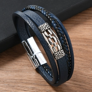 Men's retro multilayer leather bracelet with silver magnetic clasp on wooden background