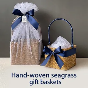 Two handmade seagrass gift baskets with blue satin bows and star sequins on white mesh