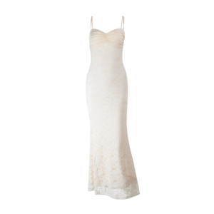 Detail of elegant lace floral embroidery and thin straps on a champagne slip dress