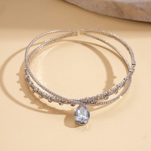 Detail shot of a silver-toned double-layered choker featuring teardrop zircon accents