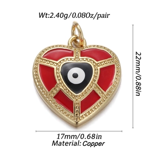 Detail view of heart-shaped evil eye copper pendant with red enamel and dimensions