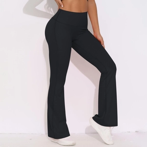 Close-up of high-waist black flare yoga pants showing elastic slimming fit and flared leg