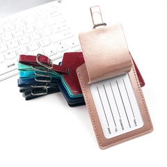 Macro detail of multi-color PU leather luggage tags with privacy flap and metal buckle