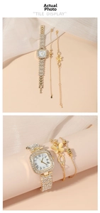 Close-up of golden square watch with rhinestones and matching butterfly bracelets set
