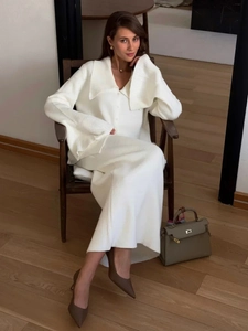 Elegant cream white knit two-piece set featuring a V-neck cardigan and high-waist maxi skirt