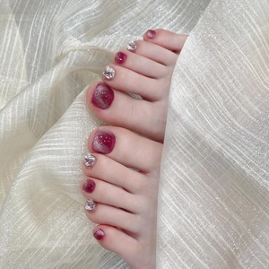 Handmade deep purple cat-eye press-on toenails with glitter and silver flake accents
