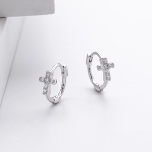 Detailed view of S925 sterling silver cross earrings with paved white zircon stones