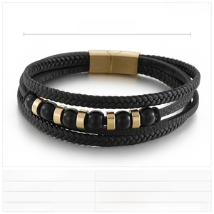 Close-up of multilayer braided leather bracelet with magnetic buckle and steel beads