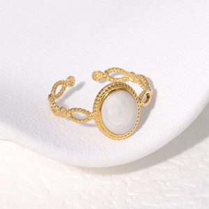 Vintage gold plated stainless steel twisted ring with white oval enamel detail